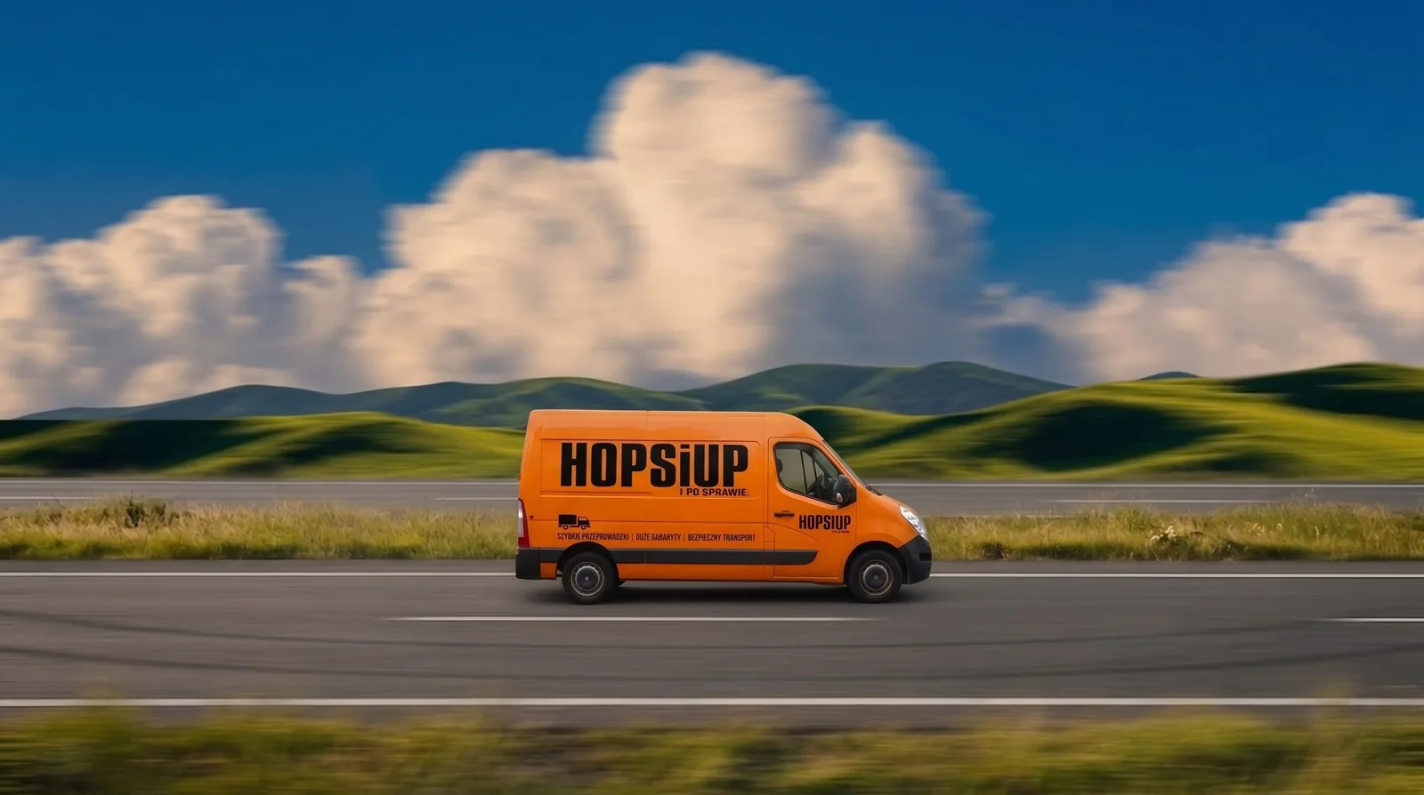 Pomarańczowy van HOPSiUP w trasie